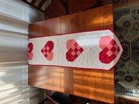 Woven heart quilted table runner